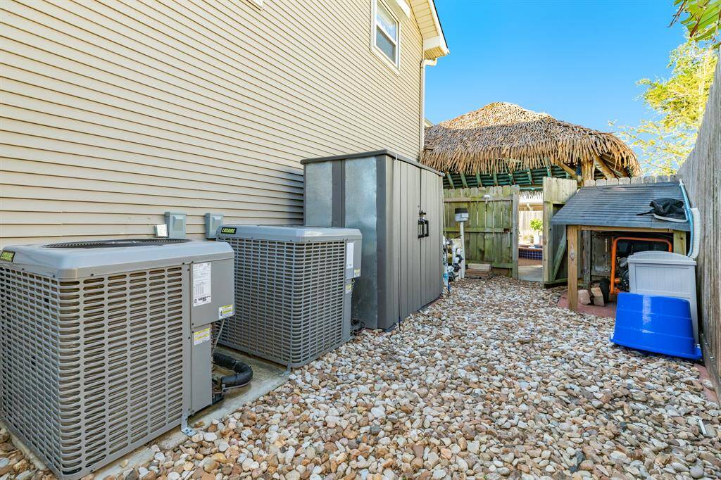 Pool equipment and AC condensers are located in a fenced in area on the NE side of the property.