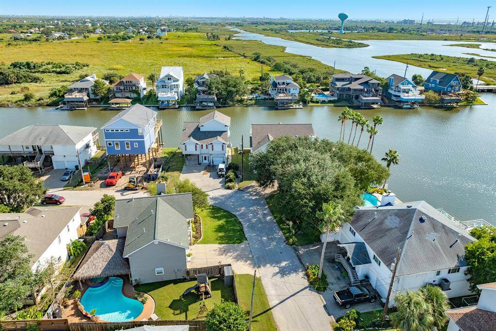 Aerial view showing the pool & palapa covered patio in addition to the side yard.
