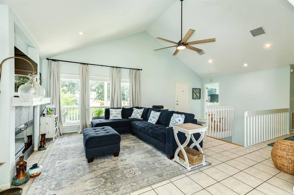 2nd level living room with vaulted celing.