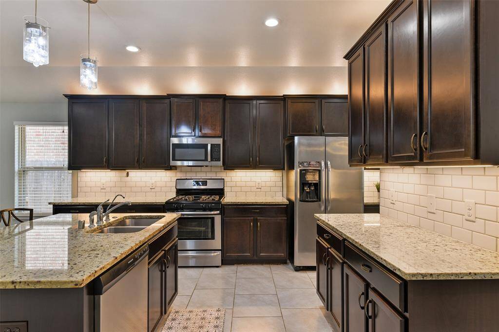 The cook of the family will appreciate the roomy pantry, the bonus butler's pantry or coffee bar, the dual basin sink, and the all stainless appliances that include a vent hood microwave, a dishwasher, a single oven, and a gas cooktop.