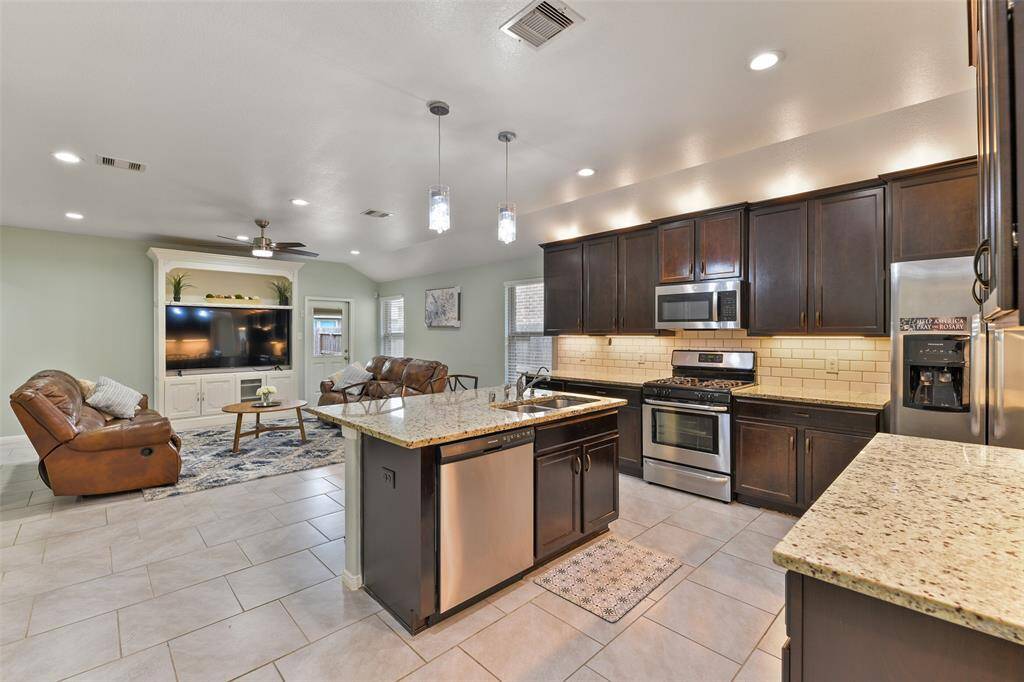 From this angle, notice the open floorplan that flows seamlessly into the main living space. It's a great floor plan for entertaining!