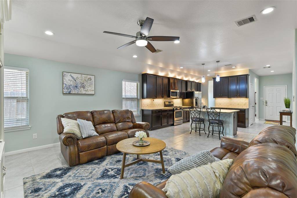 From this angle, notice the open floorplan that flows seamlessly into the main living space. It's a great floor plan for entertaining!