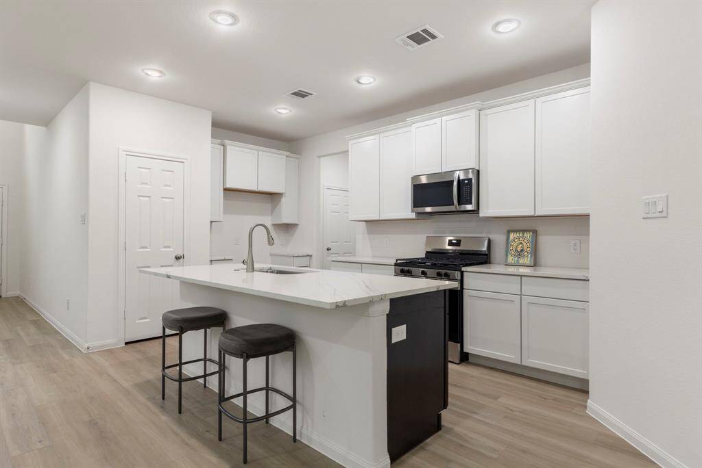 Kitchen is open to the living and dinning space.