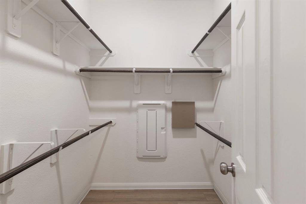 Primary bedroom walk-in closet.
