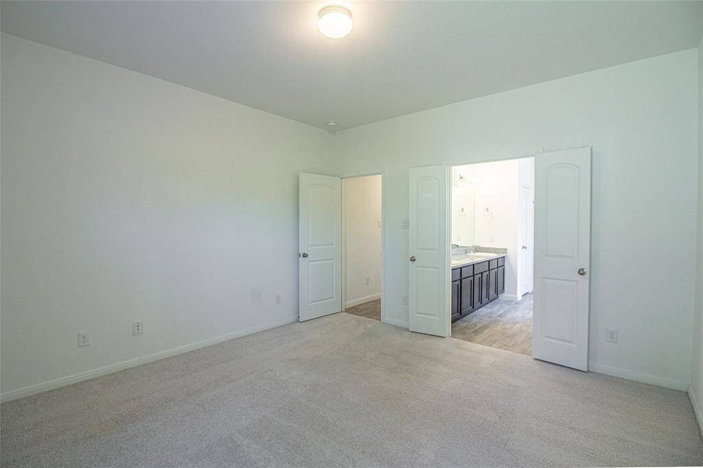 Primary bedroom is tucked away for privacy...