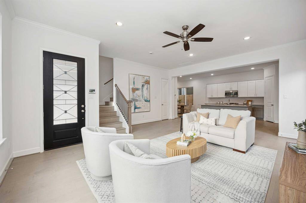 Walk through the upgraded wood-and-metal front door with Reeded glass and instantly feel the shift—this is home. Clean lines, sunlight, and an open vibe make this space feel like a breath of fresh air.