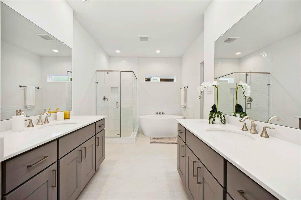 Morning routines just leveled up. Dual vanities, quartz counters, soft lighting—and enough space for two people to actually get ready in peace.