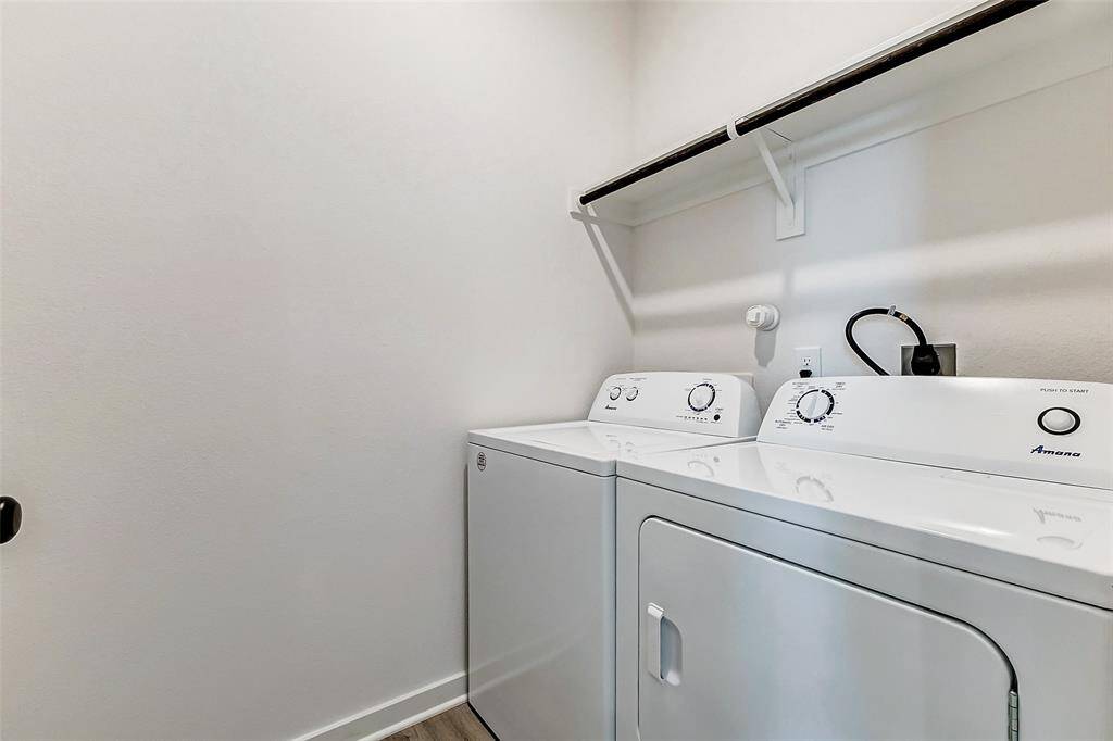 This dedicated laundry room offers modern appliances, overhead storage, and a sleek design to keep your home running smoothly. This is a picture of a Rylan Floor Plan from another Saratoga Homes.