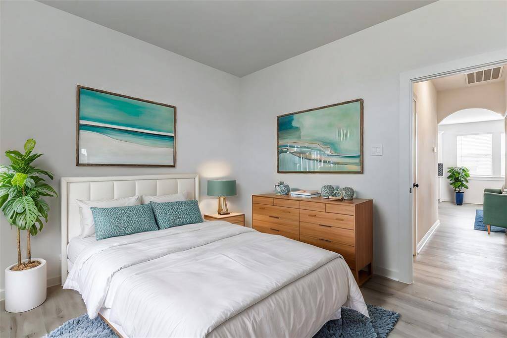 A versatile space with neutral tones and stylish wood-look flooring, ready for your personal touch. Use it as a home office, guest bedroom, or creative retreat! **This is a picture of a Rylan Floor Plan from another Saratoga Homes.**