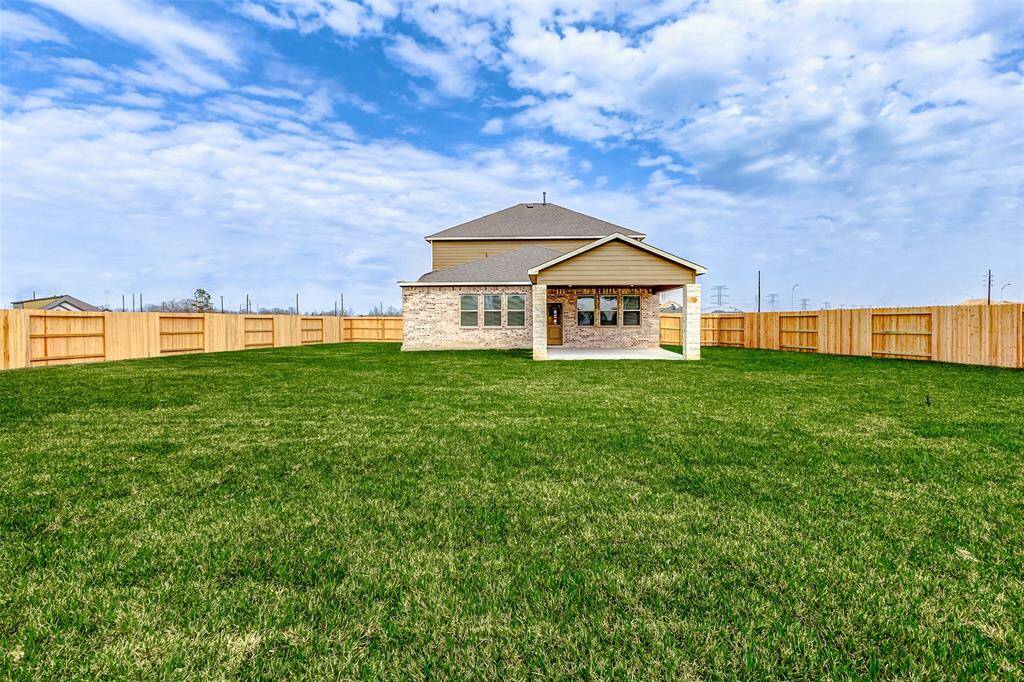 With a fully fenced yard and an extended covered patio, this home offers the perfect setting for summer barbecues, cozy fire pit nights, or simply unwinding after a long day in your private sanctuary. **This is a picture of a Rylan Floor Plan from another Saratoga Homes.**