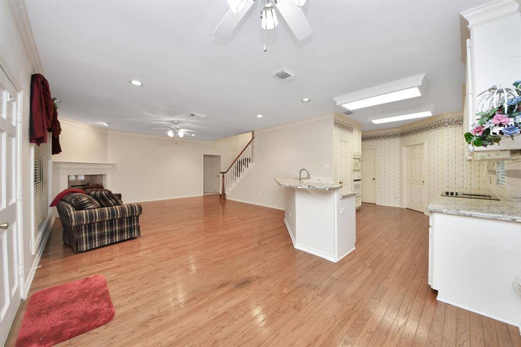 Open to the den, the kitchen creates a seamless space for family interaction, ensuring everyone can stay connected while cooking or relaxing.