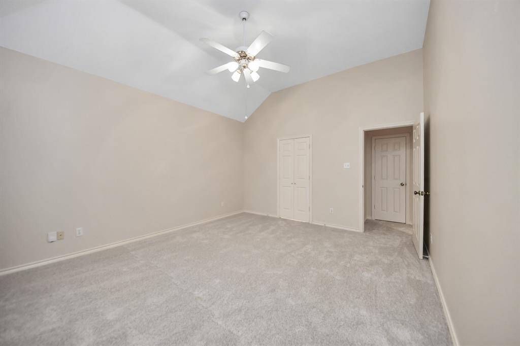 The owner's retreat offers privacy and tranquility with soft neutral walls and updated carpet for a fresh, inviting feel.