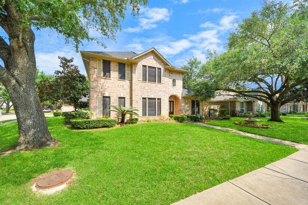 Spacious side yard offers room to breathe, while mature trees add a sense of peace and comfort—all just minutes from the conveniences of daily life.