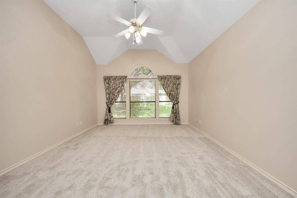 An angled ceiling adds architectural interest to this private suite, enhancing its character and charm.