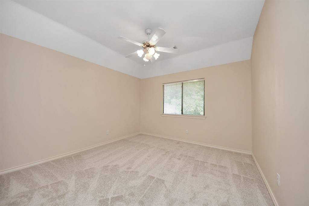 The final secondary bedroom offers versatile options—it could easily serve as a craft room, study, or guest suite.