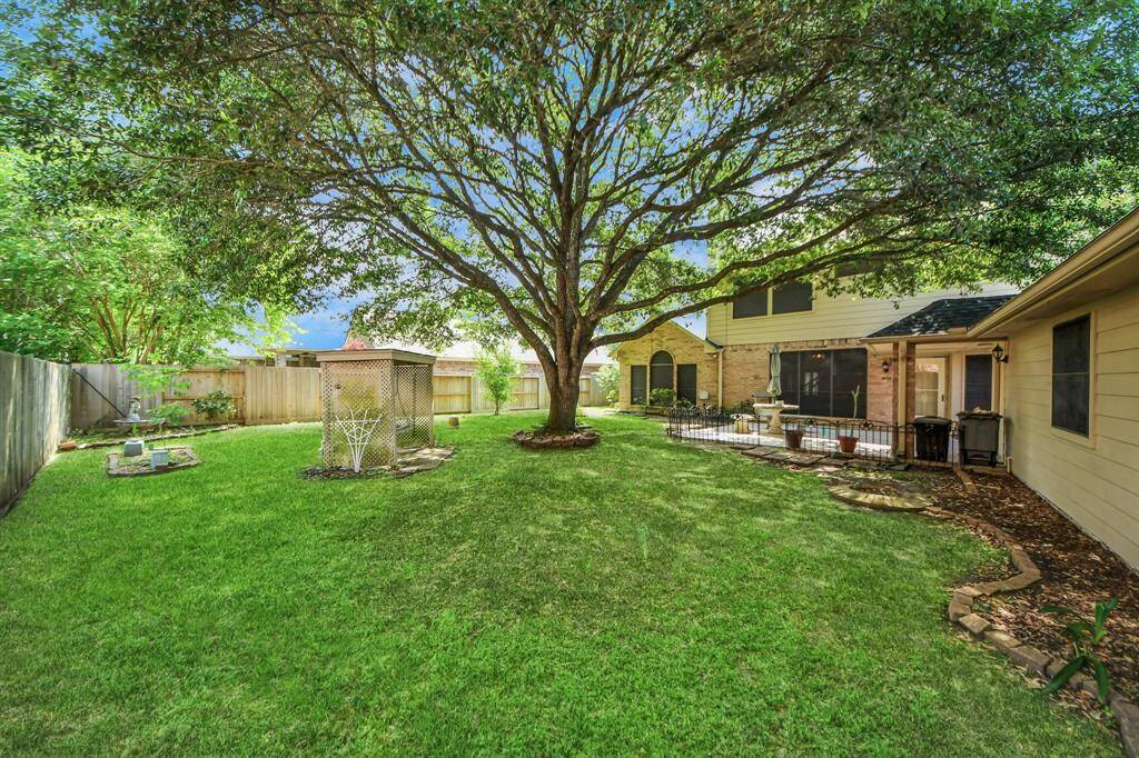 Another view of this beautiful backyard retreat, offering a serene setting perfect for relaxation.