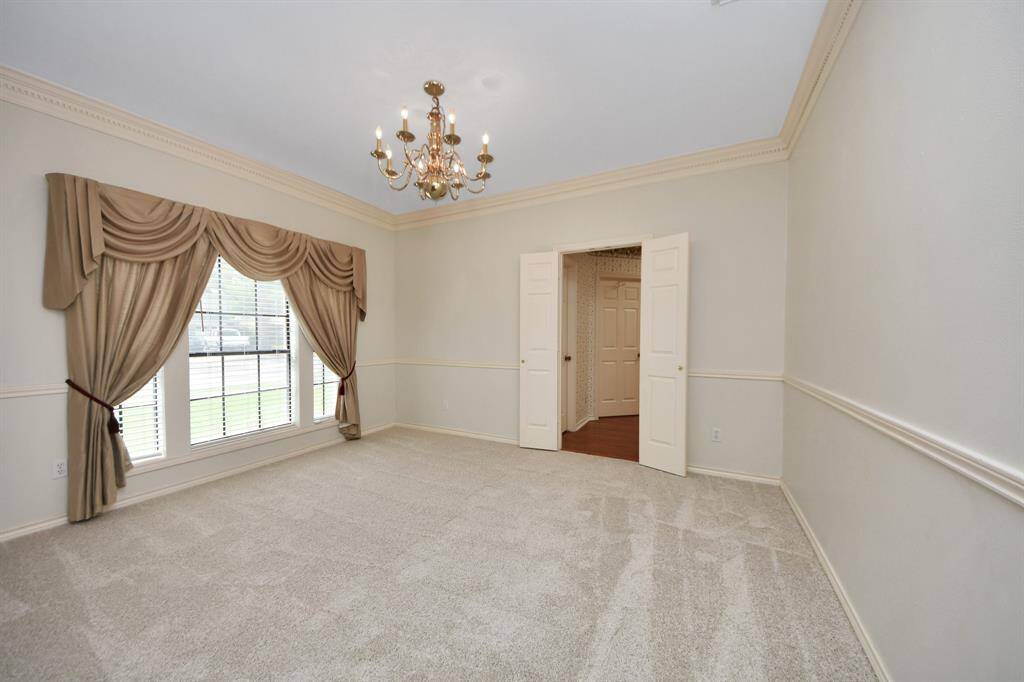 The dining room sits just off the kitchen, offering a convenient layout ideal for entertaining and holiday gatherings.