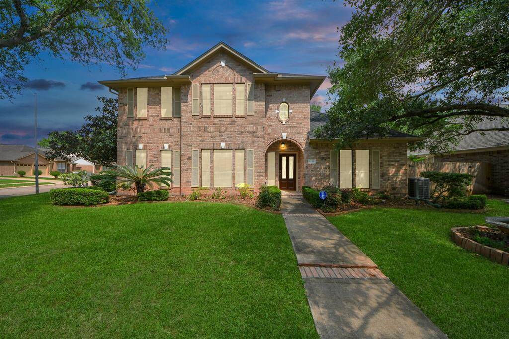 The home is captivating at night, exuding an elegance that enhances its curb appeal and welcomes you with warmth.