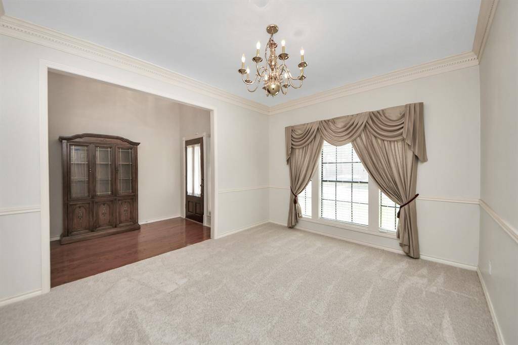 Recently updated with plush, neutral carpeting, the dining room offers ample space to accommodate substantial dining furniture with ease.