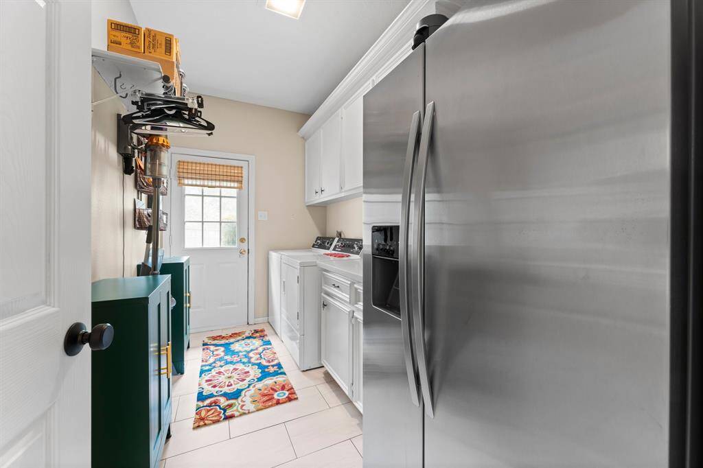 Laundry room with access to backyard.