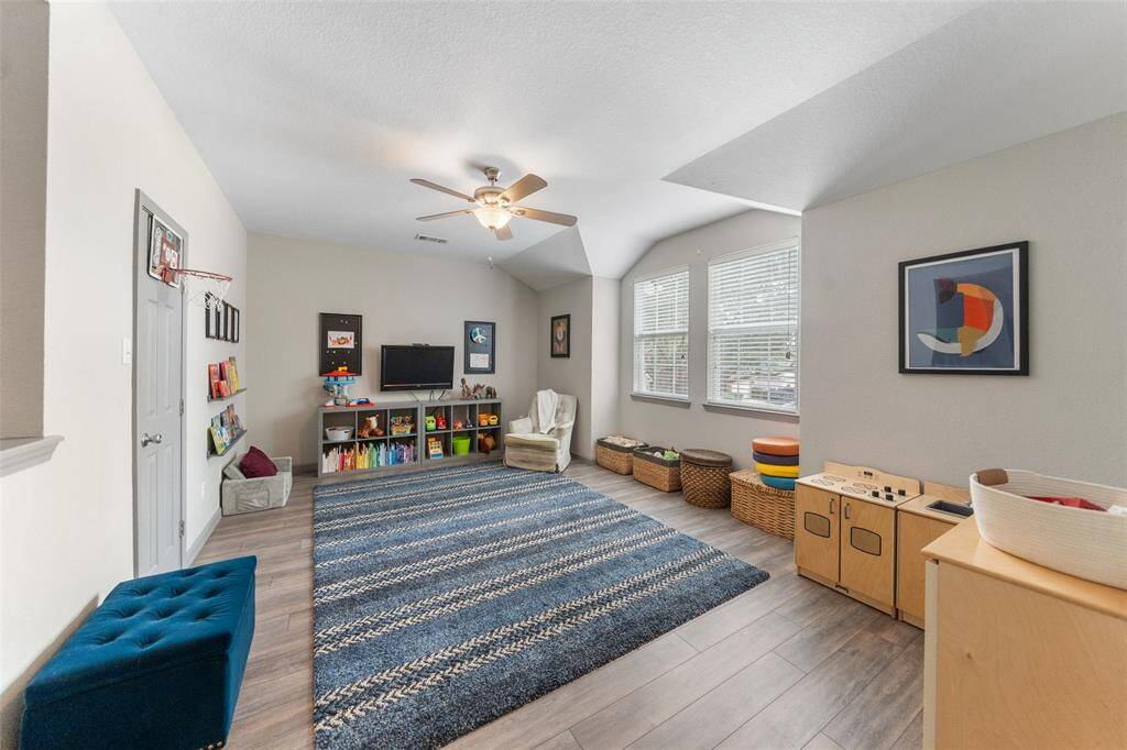 Additional closet space is through the door to the left. There is no shortage of storage in this home!