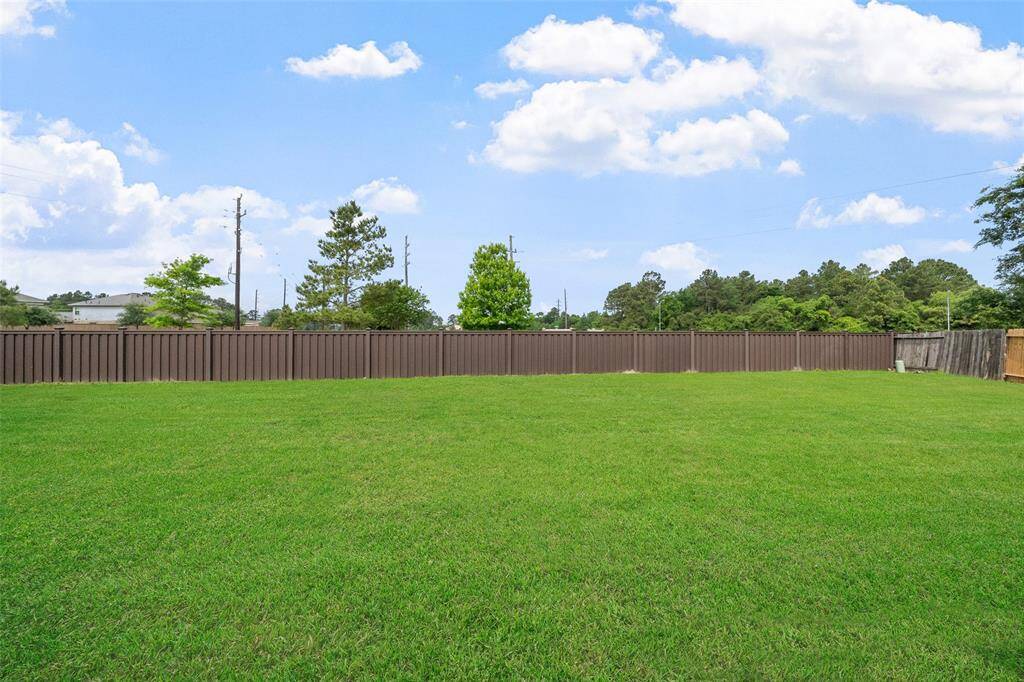 What a huge yard! Plenty of room for a pool, play ground, garden and more!