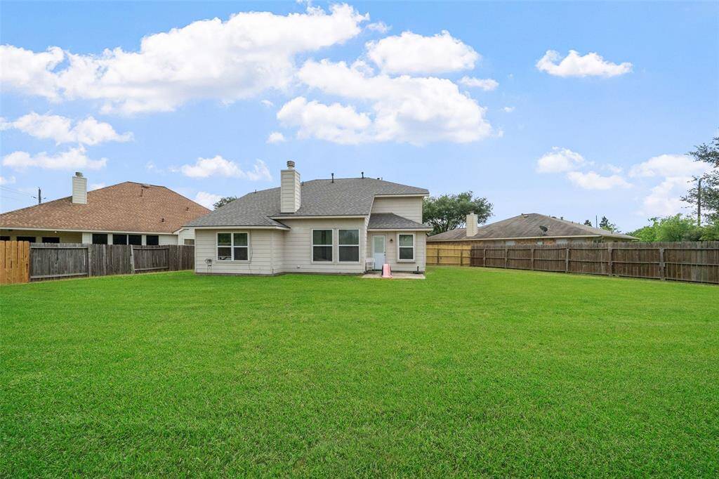 This sizable backyard is fully fenced and ready for your fury best friend.