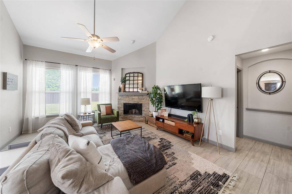 Enjoy spacious windows and a cozy gas log fireplace.