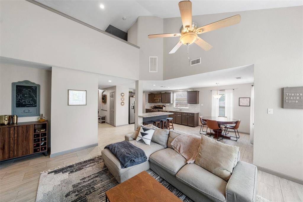 Notice the soaring ceilings and spacious living area.