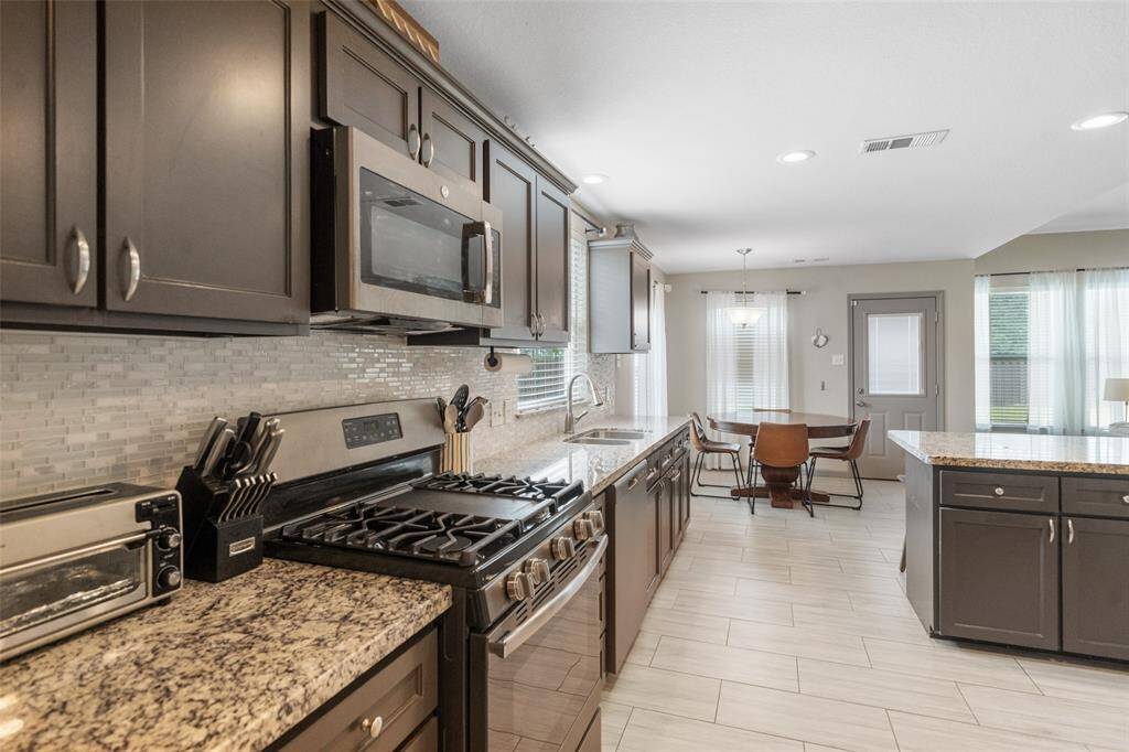 Ample counter space and cabinet storage complete this functional kitchen.