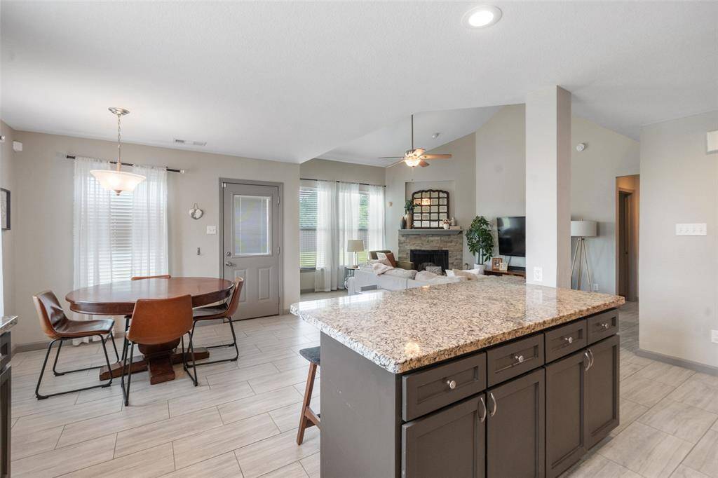 Kitchen opens up to breakfast room and living area.