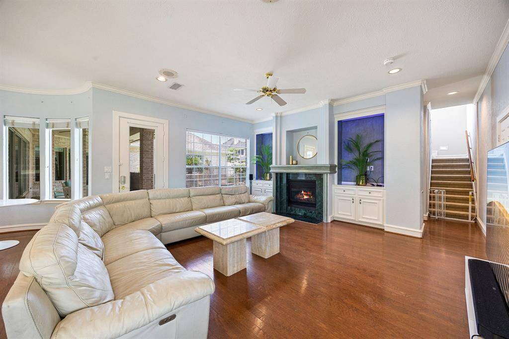 Family room with marble gas fireplace and entry into the oversized garage!