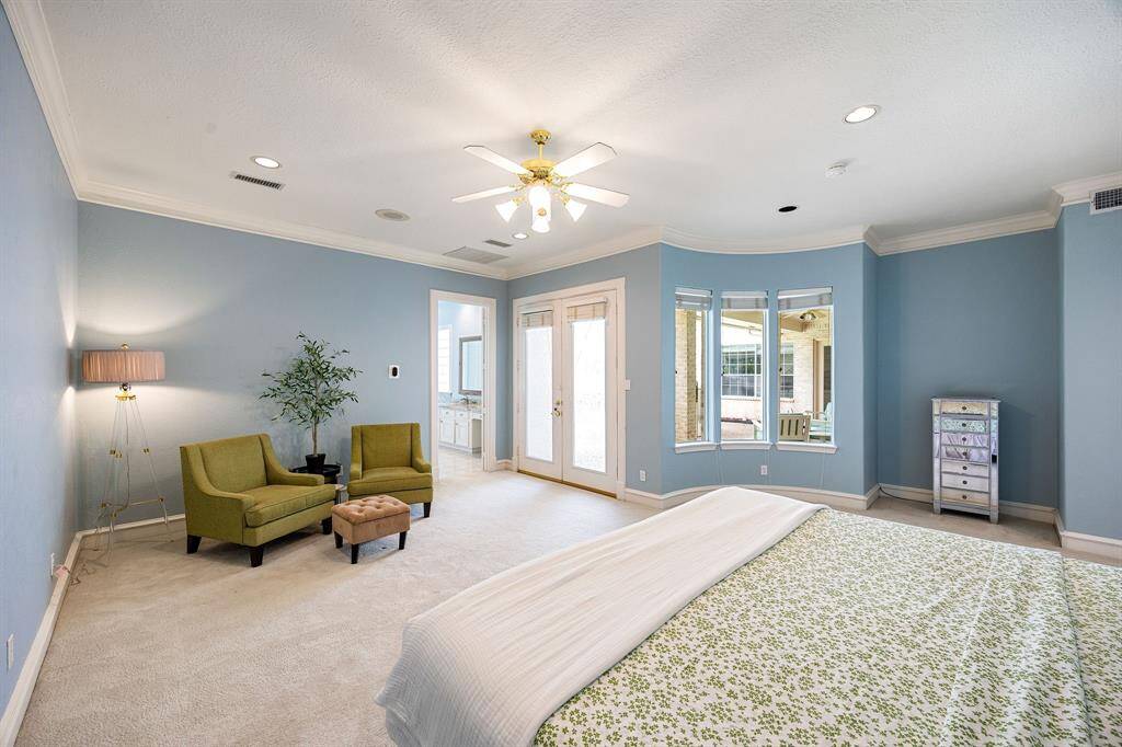 Primary suite includes direct access to outdoor spa and pool, 2 walk-in closets, shower/tub combo and more!