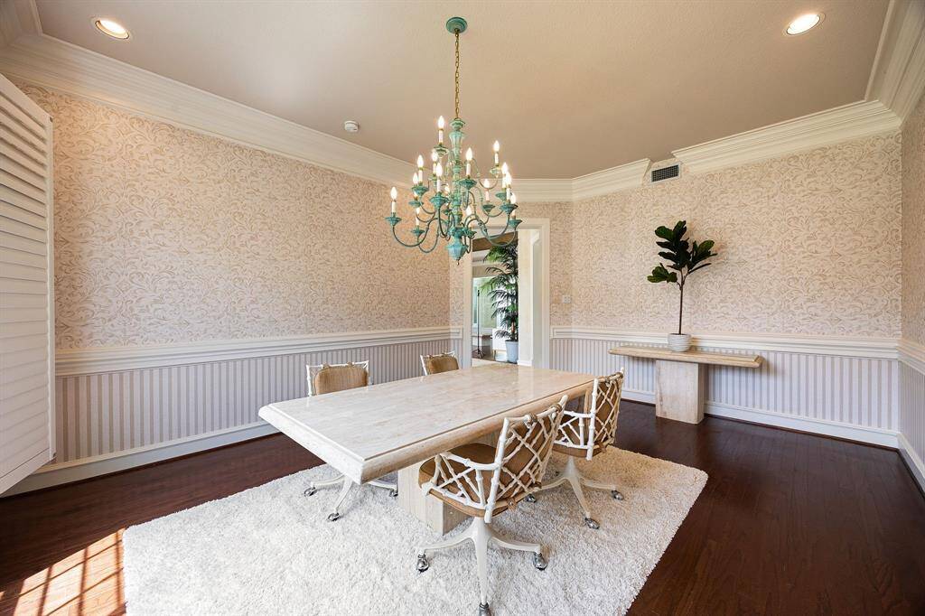 Large whirlpool tub and Two large walk-in closets off the primary bath with built-in shelves and cabinets