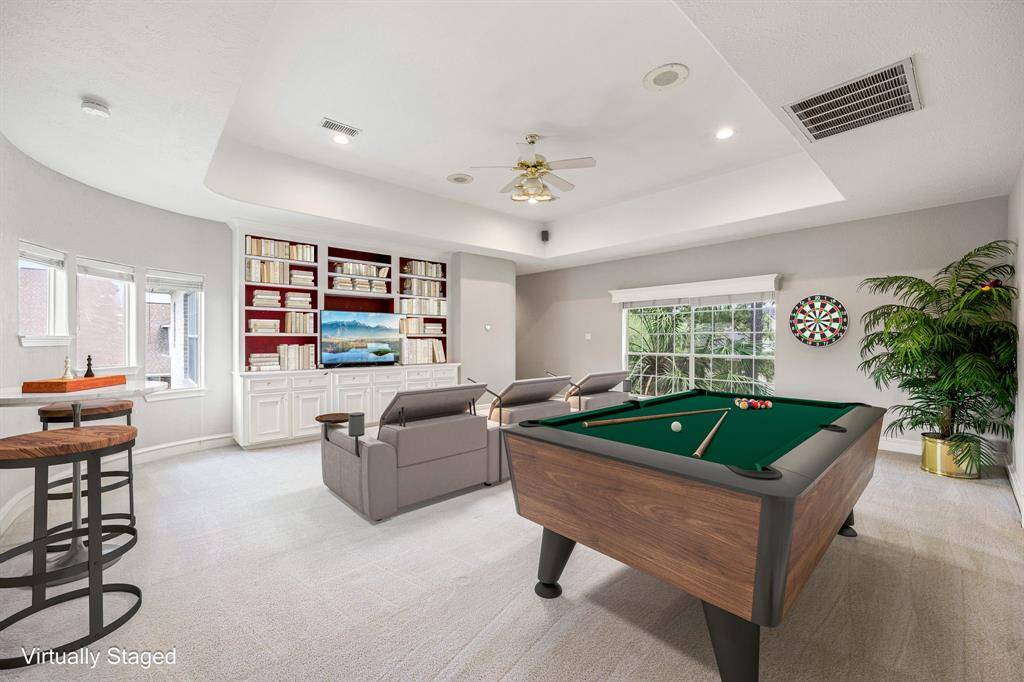 Upstairs game room with built-ins (virtually staged)