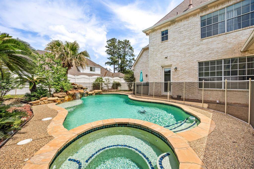 Heated inground pool with waterfall and spa!