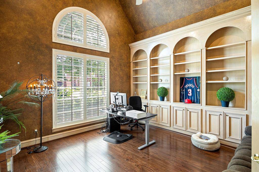 Stunning office/study with built-in  bookcases and cabinetry and wood flooring added in 2019.