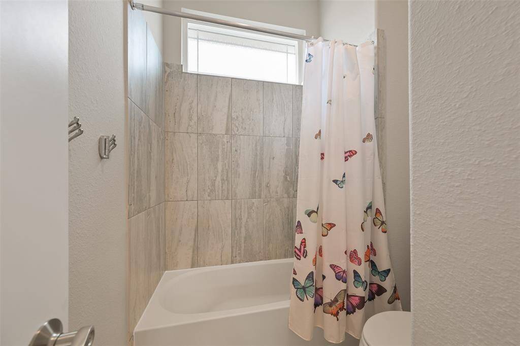 The separate room in the guest bath for the toilet and tub/shower combo shared by guest beds #1 and #2..