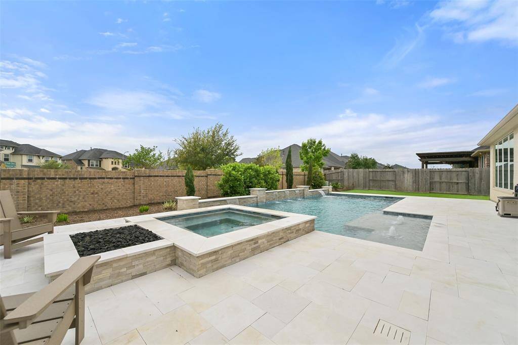 For cozy evenings outdoors, the built-in fire pit offers a warm and inviting gathering place. Whether you're enjoying a cool night with friends or relaxing with family, the fire pit creates a perfect ambiance for making memories