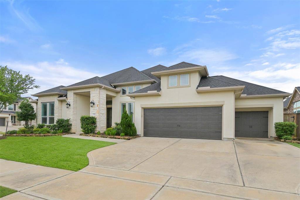Triple wide driveway leads to an attached FOUR CAR garage with 3 traditional spots and 1 tandem parking spot. This home has it all! Media room, game room, study, formal dining and family room!