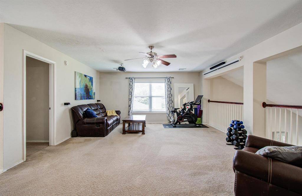 Game room is large with windows.
