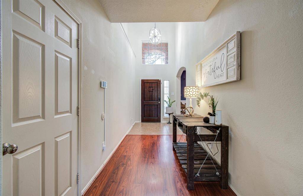 To the left in the entry is door to the garage.
