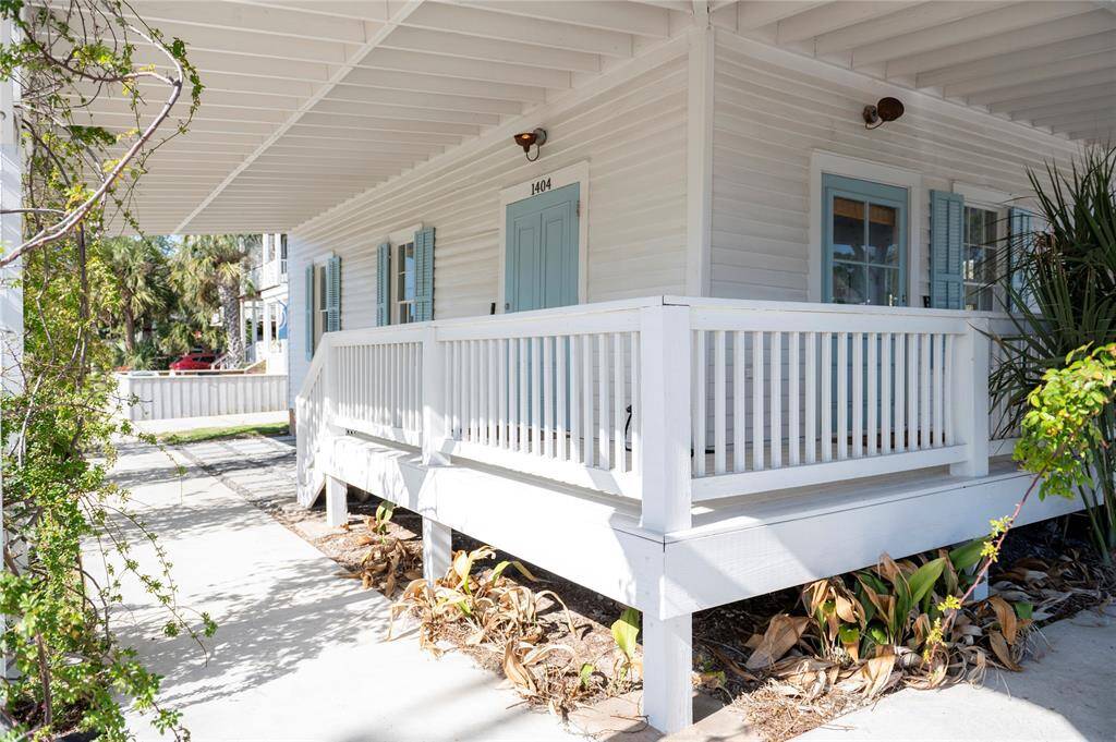Charming wraparound porch—perfect for enjoying island breezes with sun and rain protection.