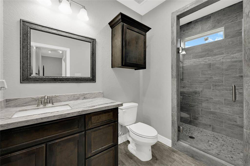 Second primary bath with standing shower.