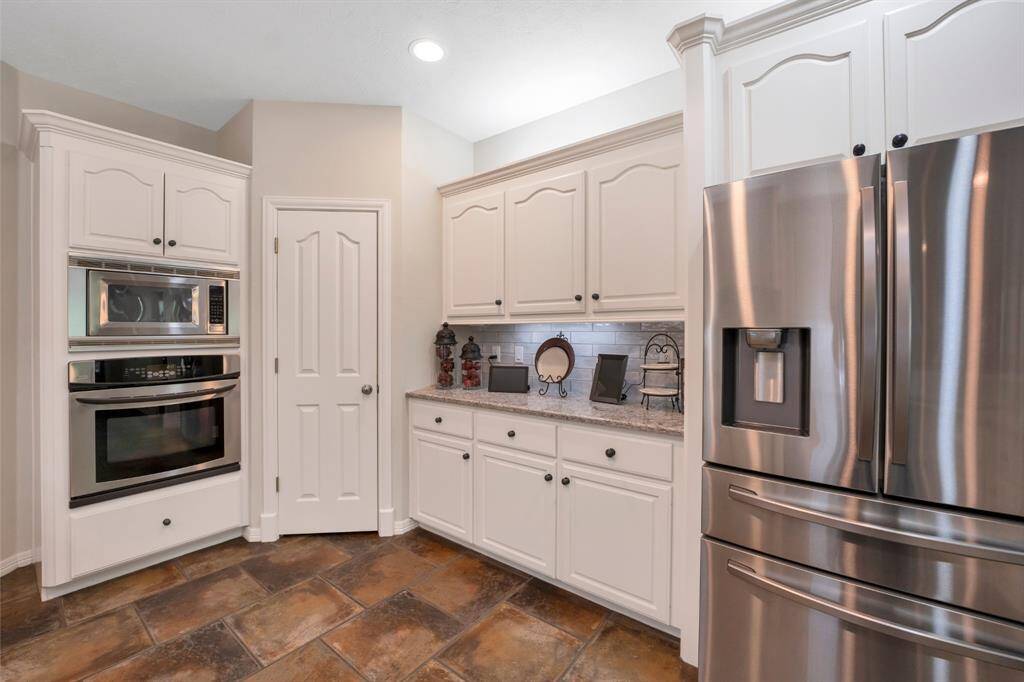 Stainless steel appliances, wall oven and a walk-in pantry