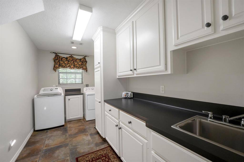 Large Laundry room with plenty of storage space