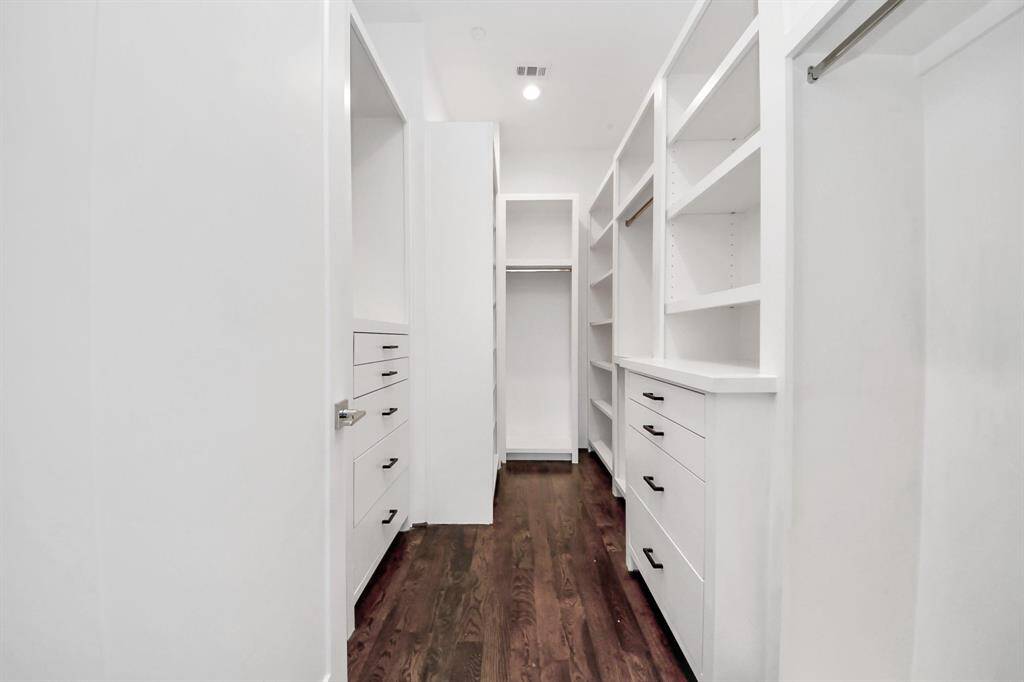 Primary bedroom walk-in closet