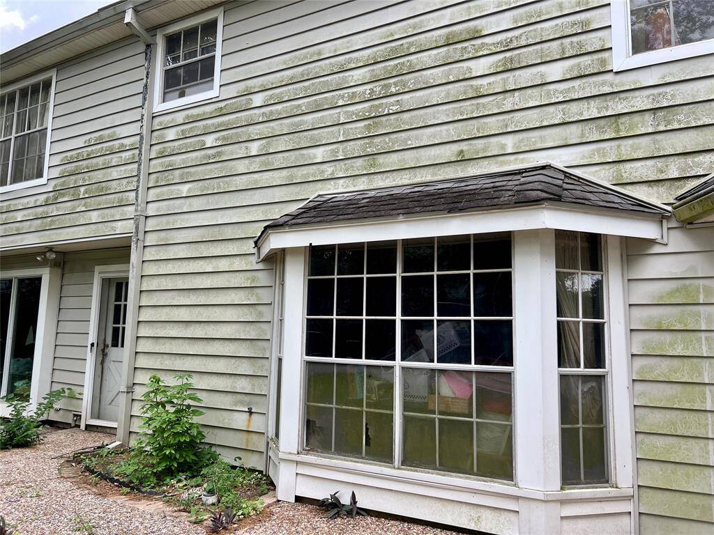 The door under the walkway leads into the laundry and then kitchen.