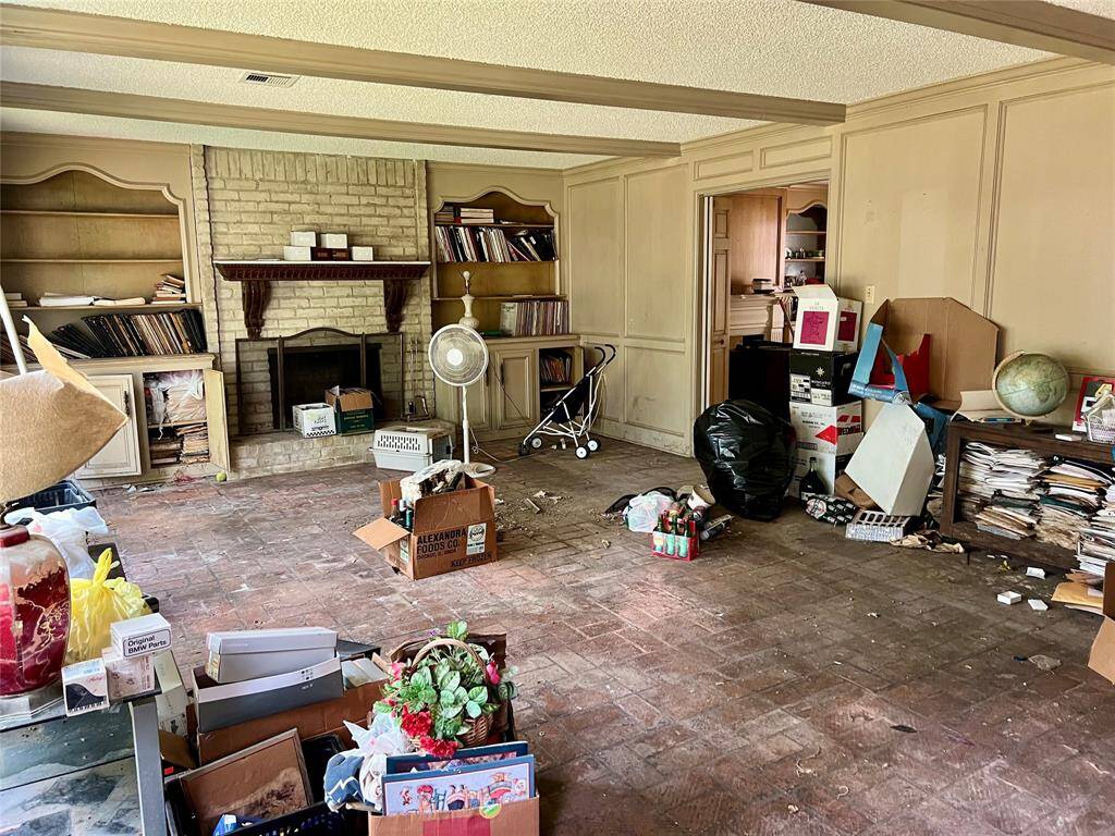 From the fireplace end, looking back toward back door and kitchen area.