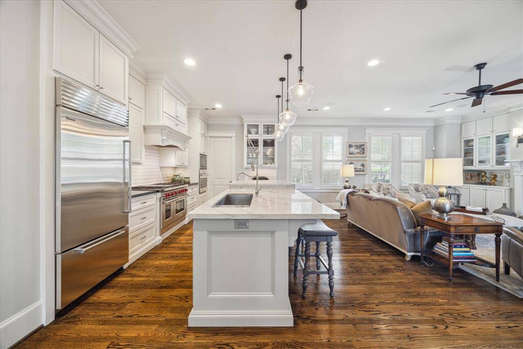 Seamlessly connected, the kitchen and family room create an expansive, light-filled hub designed for effortless living and entertaining.